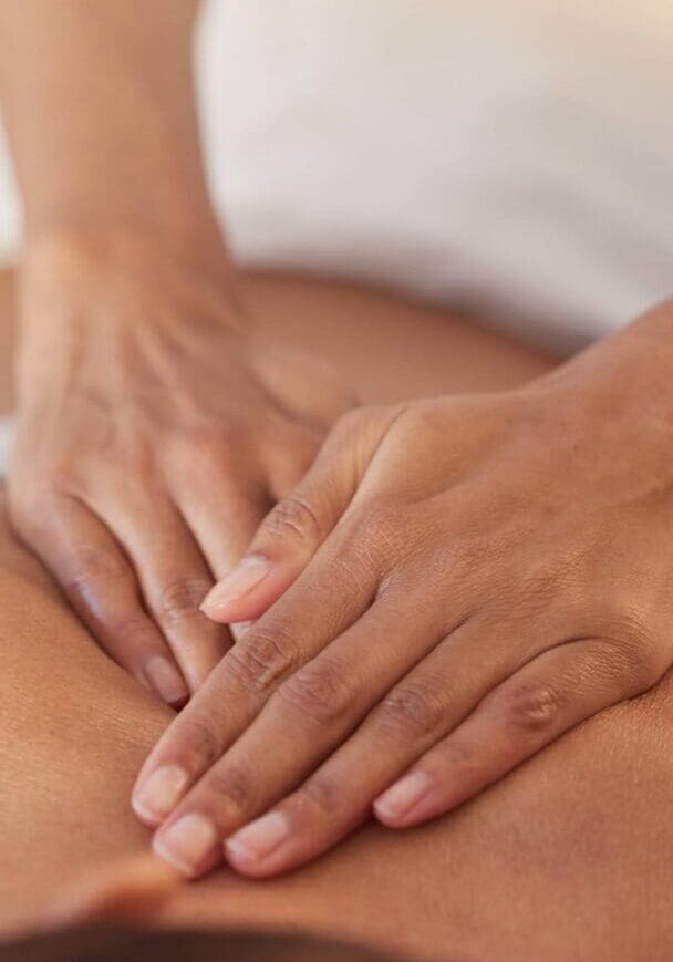 1 Hands giving a relaxing back massage.